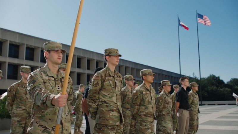 ROTC cadets stand in formation outside during training